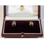 A boxed pair of Asprey 18ct gold & hematite buckle