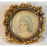 An ornate 19thC. French 18ct gold brooch set with