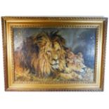 A gilt framed oil of a lion & lioness signed L. A.