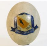 A hand painted penguin egg with the motto: The Des