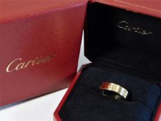 A boxed 18ct gold Cartier "Love Ring" size T/U 8.6g