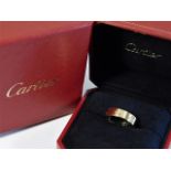 A boxed 18ct gold Cartier "Love Ring" size T/U 8.6g