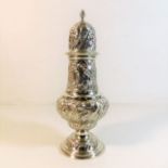 A good embossed Chester silver sugar caster by Geo