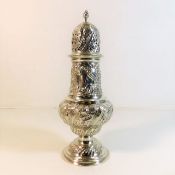 A good embossed Chester silver sugar caster by Geo