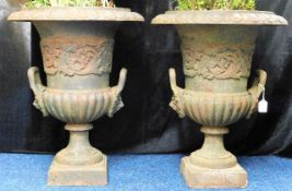 A pair of large Victorian cast iron garden urns, e