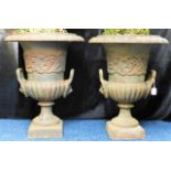 A pair of large Victorian cast iron garden urns, e