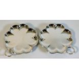 A pair of Cartier of London silver dishes with sca