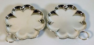 A pair of Cartier of London silver dishes with sca