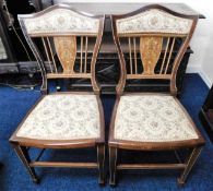 A pair of Edwardian inlaid chairs