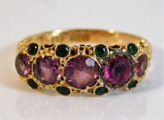 An antique Suffragette style ring set with garnet