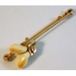 An 18ct three colour gold brooch set with teeth 8.7g