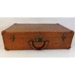 An antique Louis Vuitton leather suitcase