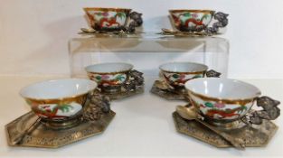 A set of six Chinese porcelain cups with decorativ