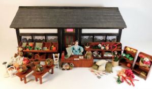 A dolls grocers shop with accessories 29.25in wide