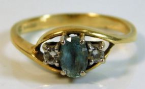 An 18ct gold ring set with diamond & aqua 3.4g siz