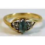 An 18ct gold ring set with diamond & aqua 3.4g siz