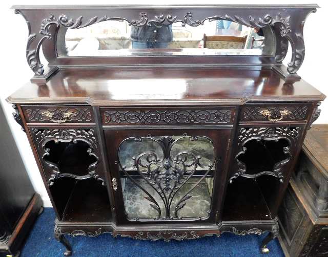 A decorative mahogany display cabinet with mirror