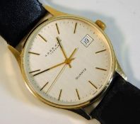 A gents 9ct gold cased Garrard quartz wrist watch,