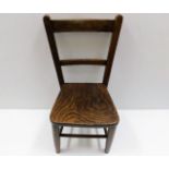 An antique elm childs chair 24in high to back