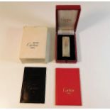 A Cartier lighter with original box