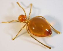 A yellow metal amber bug brooch with Russian marks