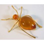 A yellow metal amber bug brooch with Russian marks