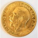 A 1911 George V gold sovereign with letter "m" under chin of King 7.9g, tests as 22ct gold