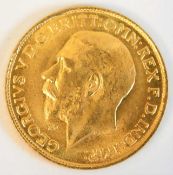 A 1911 George V gold sovereign with letter "m" under chin of King 7.9g, tests as 22ct gold
