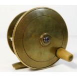 An antique brass fly fishing reel 3.62in diameter