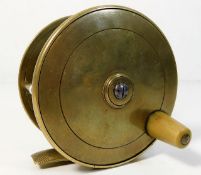 An antique brass fly fishing reel 3.62in diameter