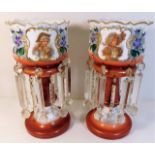 A pair of decorative pictorial glass lustres 14.5i