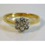 An 18ct gold daisy ring set with approx. 0.5ct dia