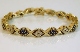 A 14ct gold diamond & sapphire bracelet 20.4g