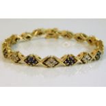 A 14ct gold diamond & sapphire bracelet 20.4g