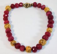 A faceted ruby & silver gilt necklace 103.5g appro