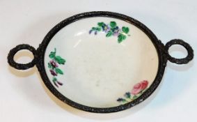 A French porcelain bowl with decorative silver mou