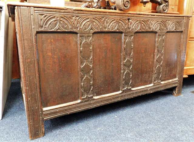 An 18thC. oak coffer with carved decor 53in wide x