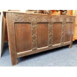 An 18thC. oak coffer with carved decor 53in wide x