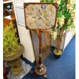 A Victorian rosewood firescreen with framed embroi