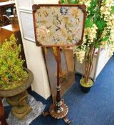 A Victorian rosewood firescreen with framed embroi