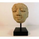 An early mounted carved stone head of possibly a P
