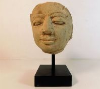 An early mounted carved stone head of possibly a P