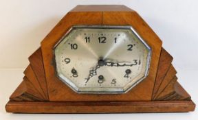 An art deco mantle clock, small loss to veneer 16.