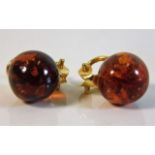 A pair of gilt mounted clip on amber earrings £20-