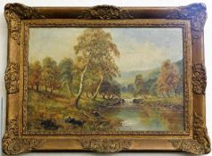 A gilt framed landscape oil on canvas depicting a