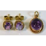 A pair of 9ct gold mounted amethyst earrings twinn