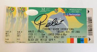 A hand signed Pele signature on football match tic