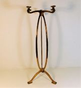 A brass Archibald Knox style art nouveau brass sta