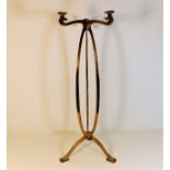 A brass Archibald Knox style art nouveau brass sta