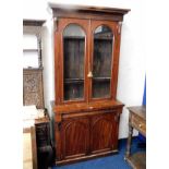 A Victorian mahogany bookcase with cupboard under